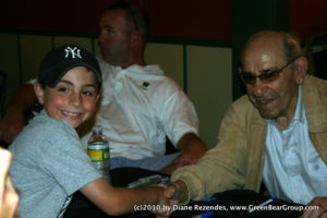Yogi Berra greets a young Yankees fan.