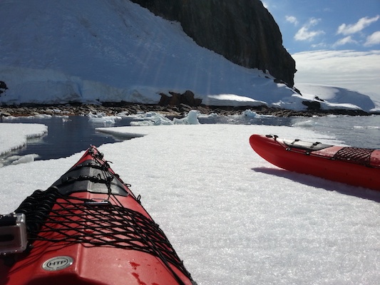 Kayaking up onto fast ice