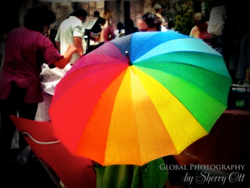 A colorful rainbow umbrella in Costa Brava Spain