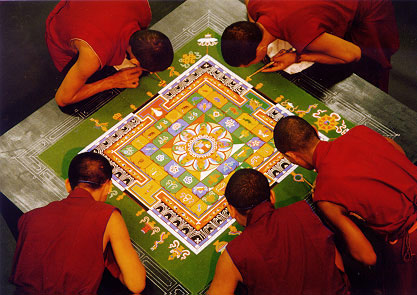 Buddhist monks create an intricate sand mandala